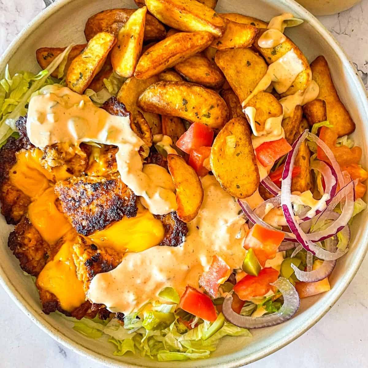 Salmon Burger Bowl drizzled with creamy burger sauce.