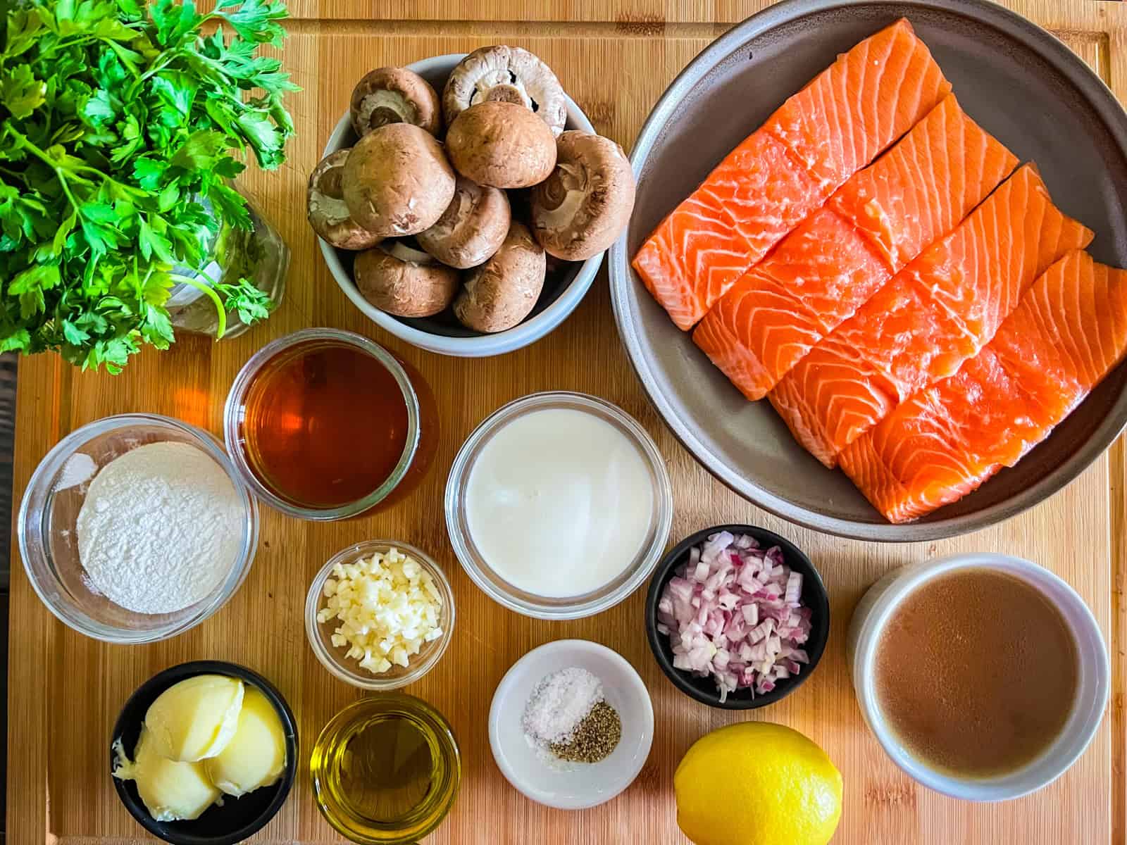 Ingredients for Salmon Marsala on a table.