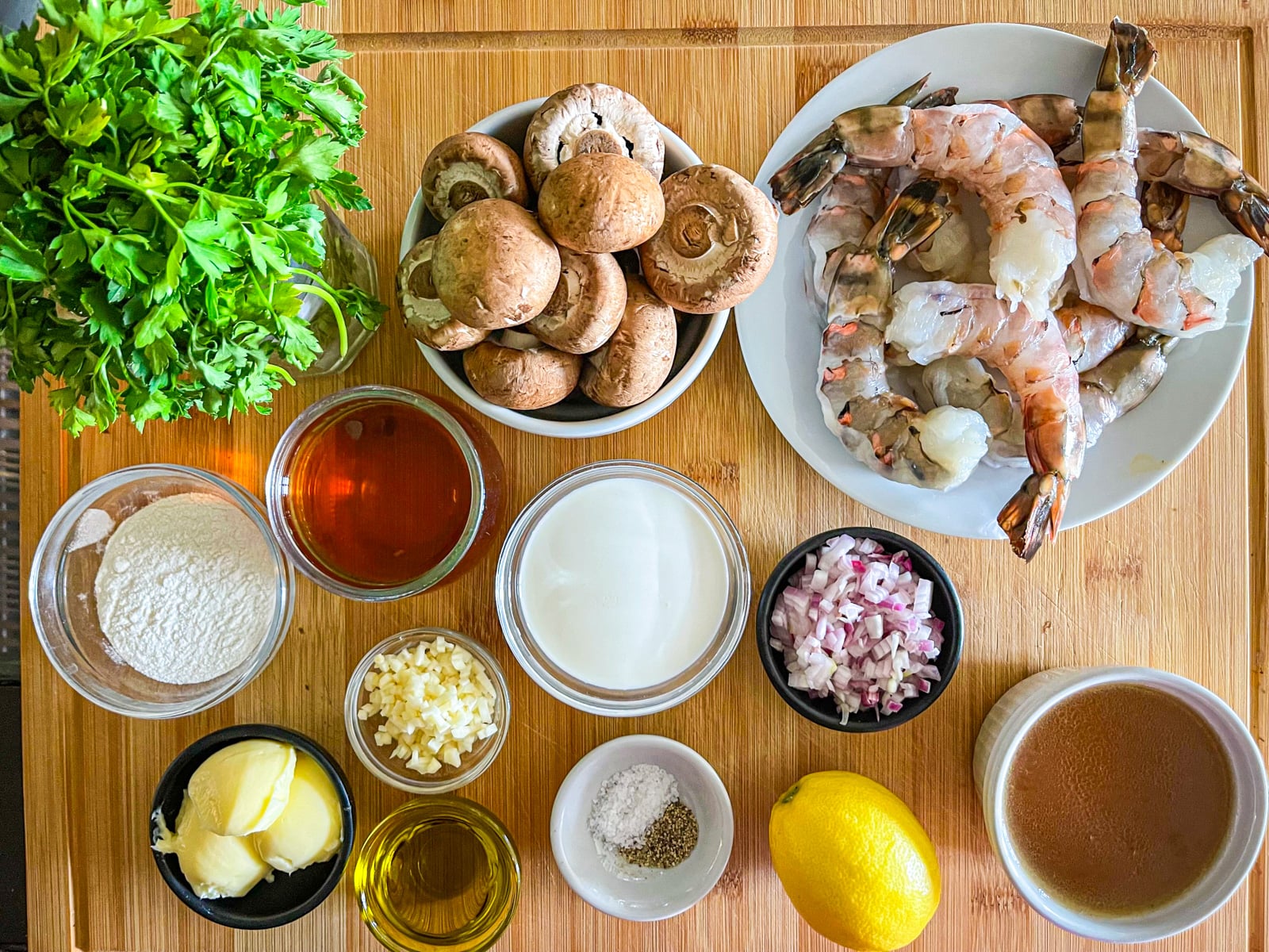 Ingredients for Shrimp Marsala on a table.