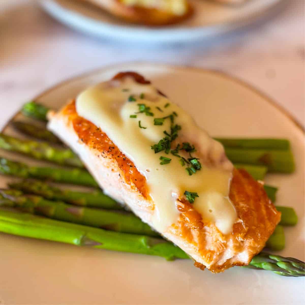 Seared Salmon With Lemon Butter Sauce over asparagus.
