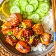 HIbachi Bites in a bowl with rice and cucumber.