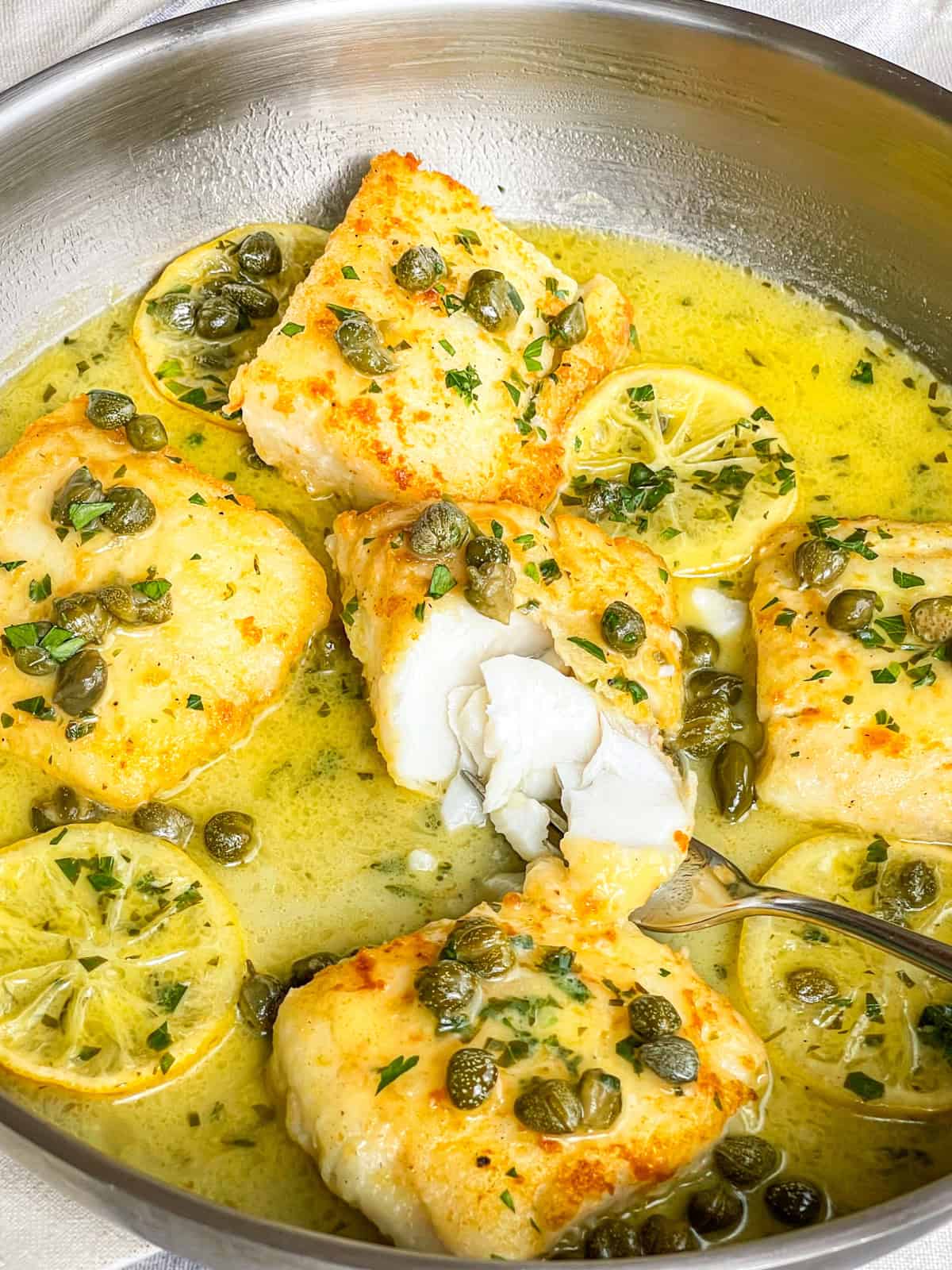 cod piccata in a skillet