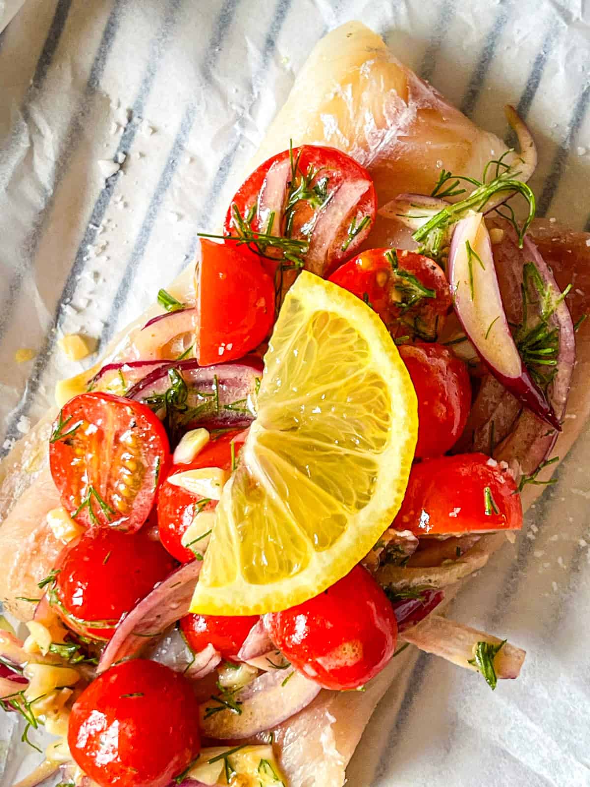 tomato dill mix laid on top of fish.