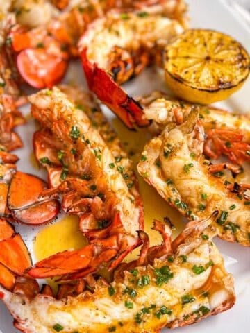 Grilled Lobster Tails on a white platter