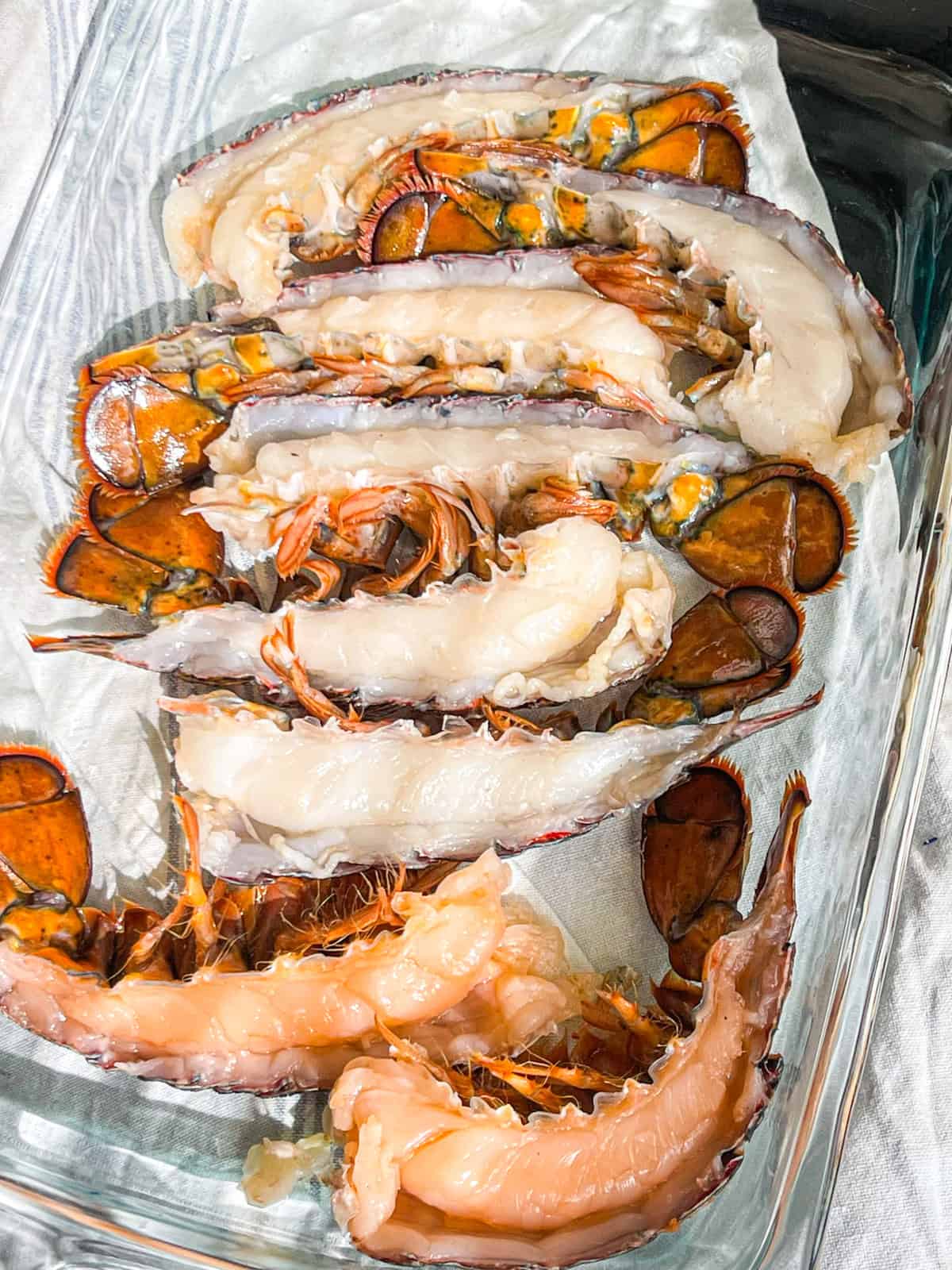 lobster tails in a pan.