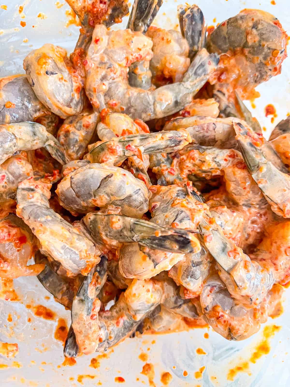 SHrimp mix with sauce in a bowl.