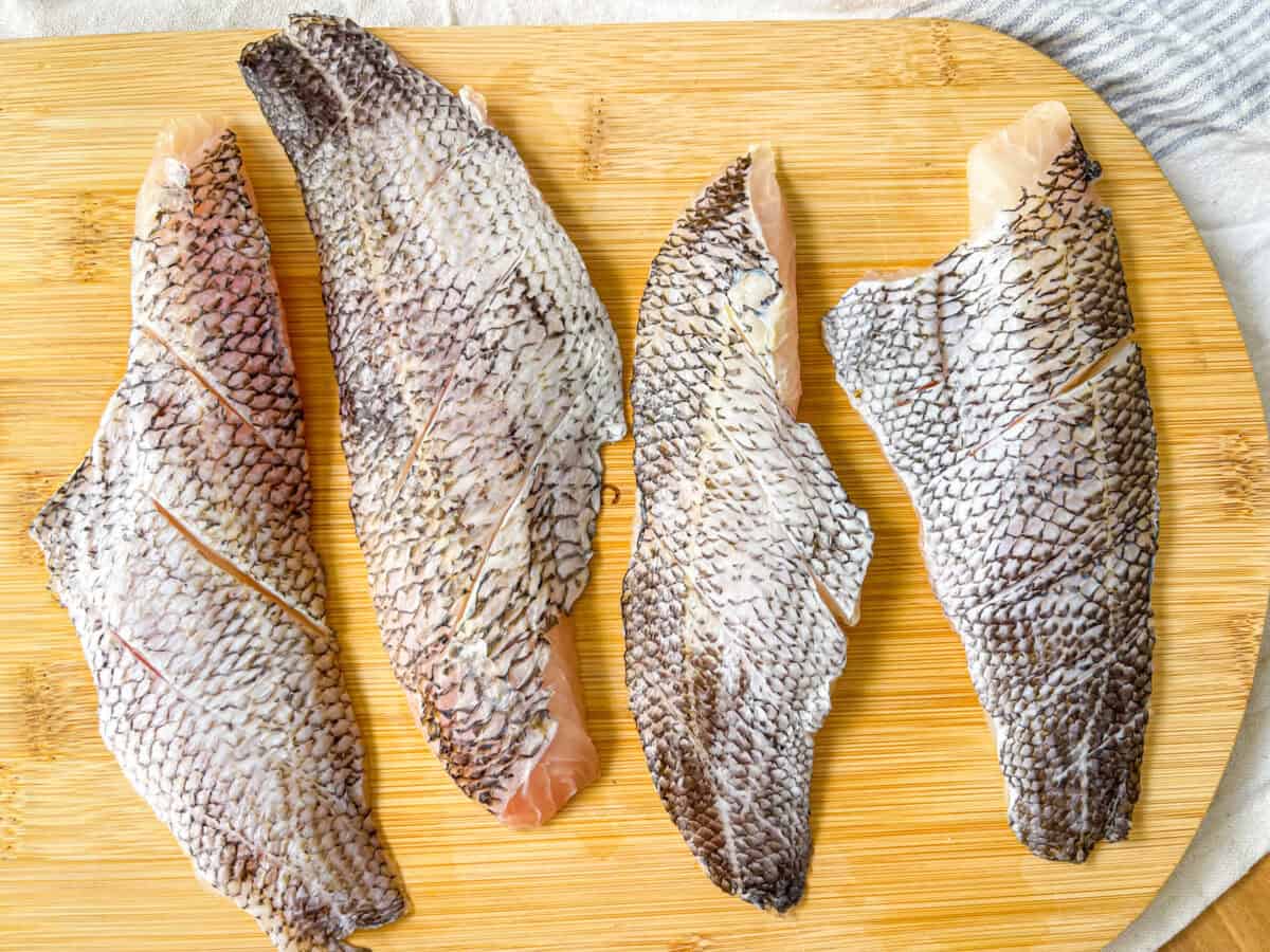 skin side up sea bass with slits on the skin.