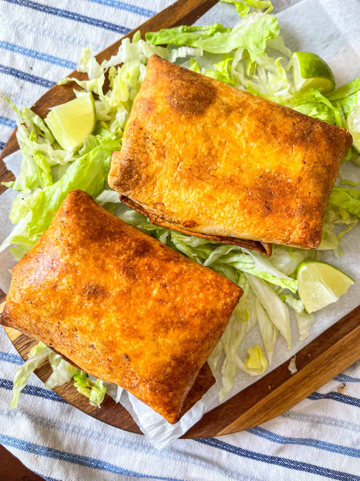 two shrimp chimichanga on a platter.