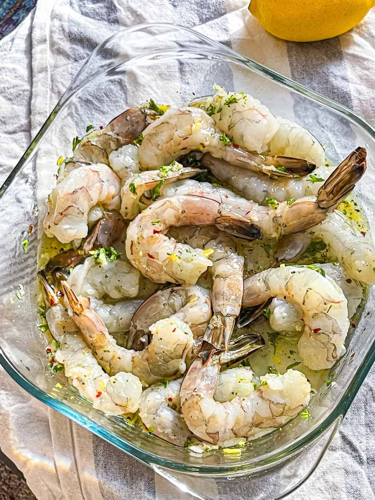 Shrimp in a bowl with marinade.