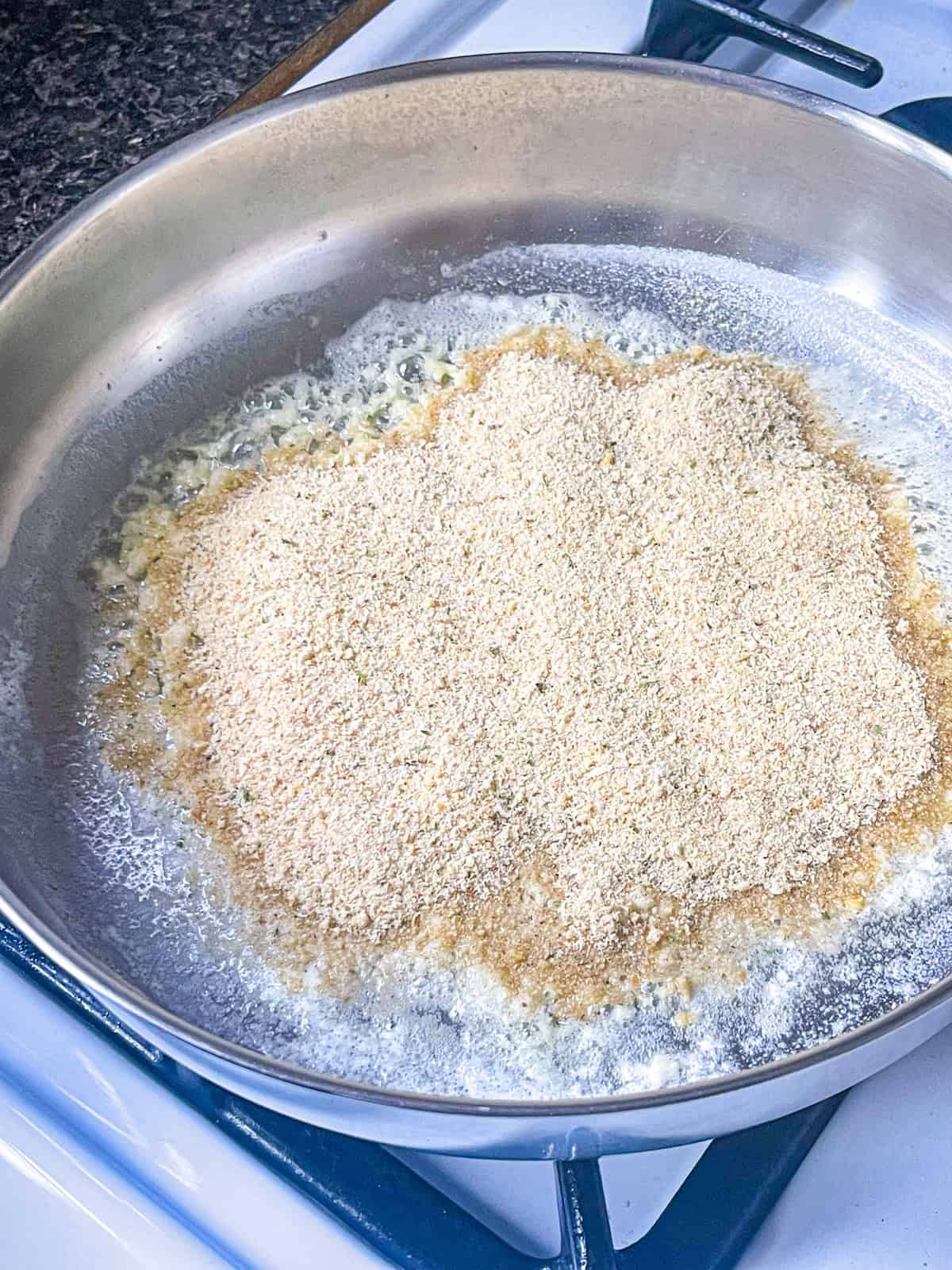 Bread crumbs tossed in a skillet with butter.