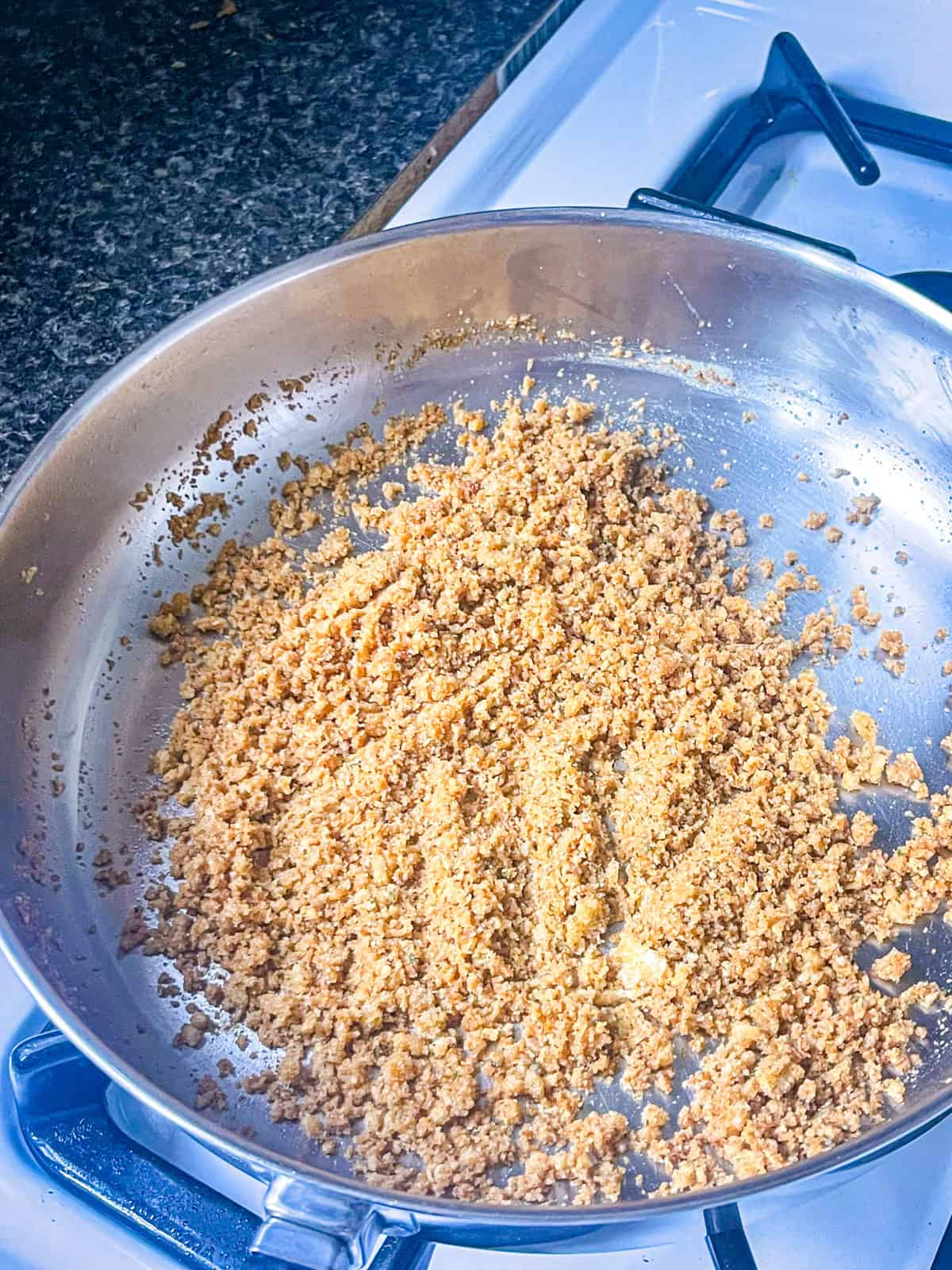 Bread crumbs tossed in a skillet with butter and cooked till brown.