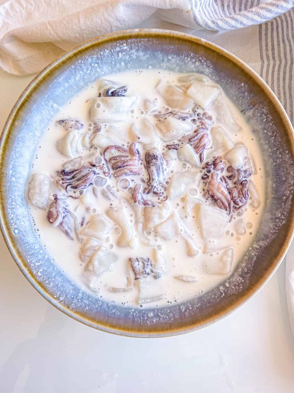 calamari rings and tentacles in buttermilk.