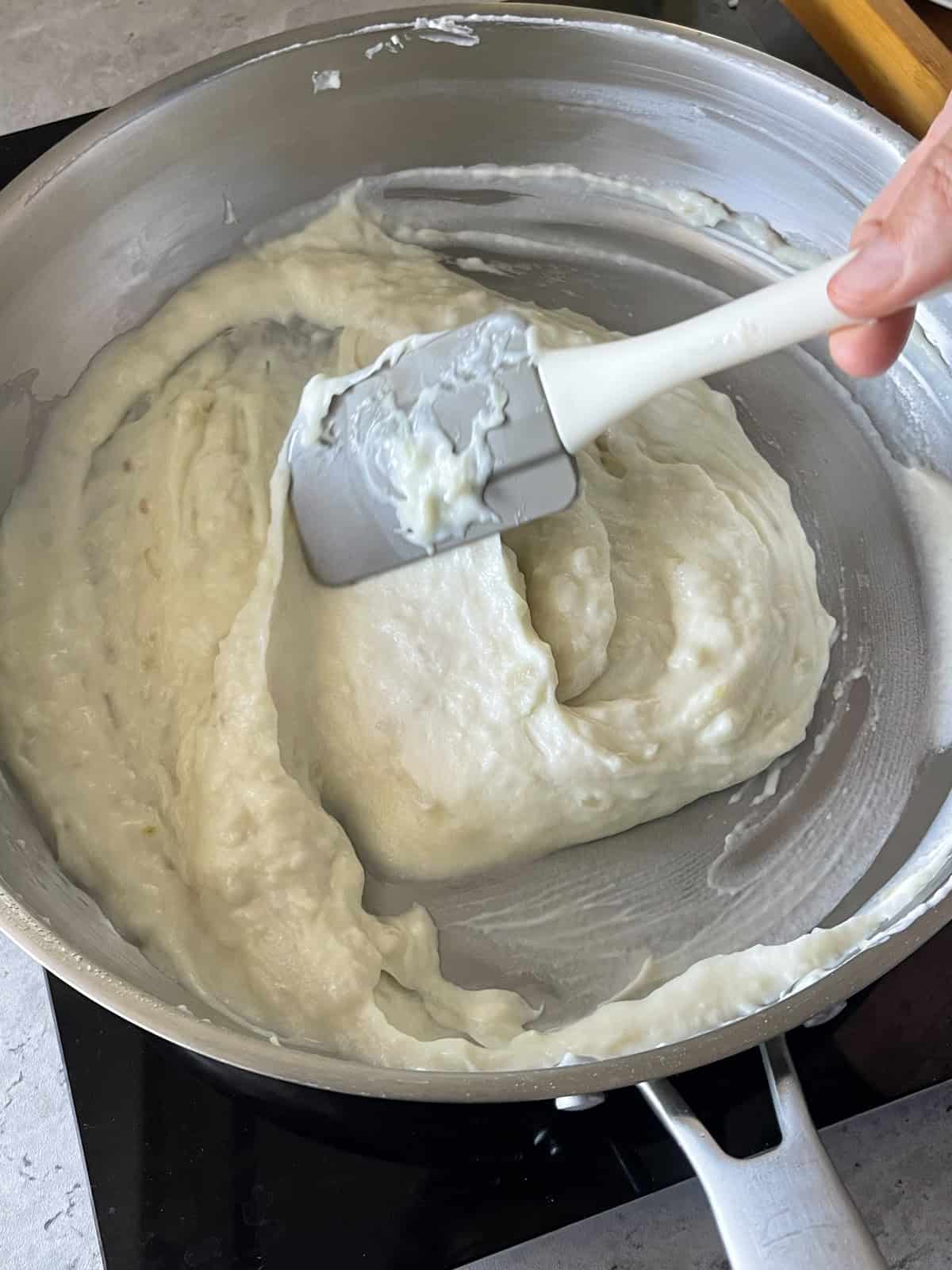 béchamel for croquetas pulling away from the sides of the pan.