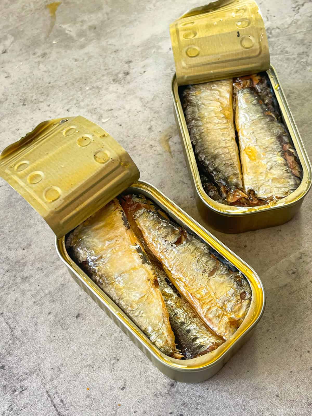 2 open cans sardines.